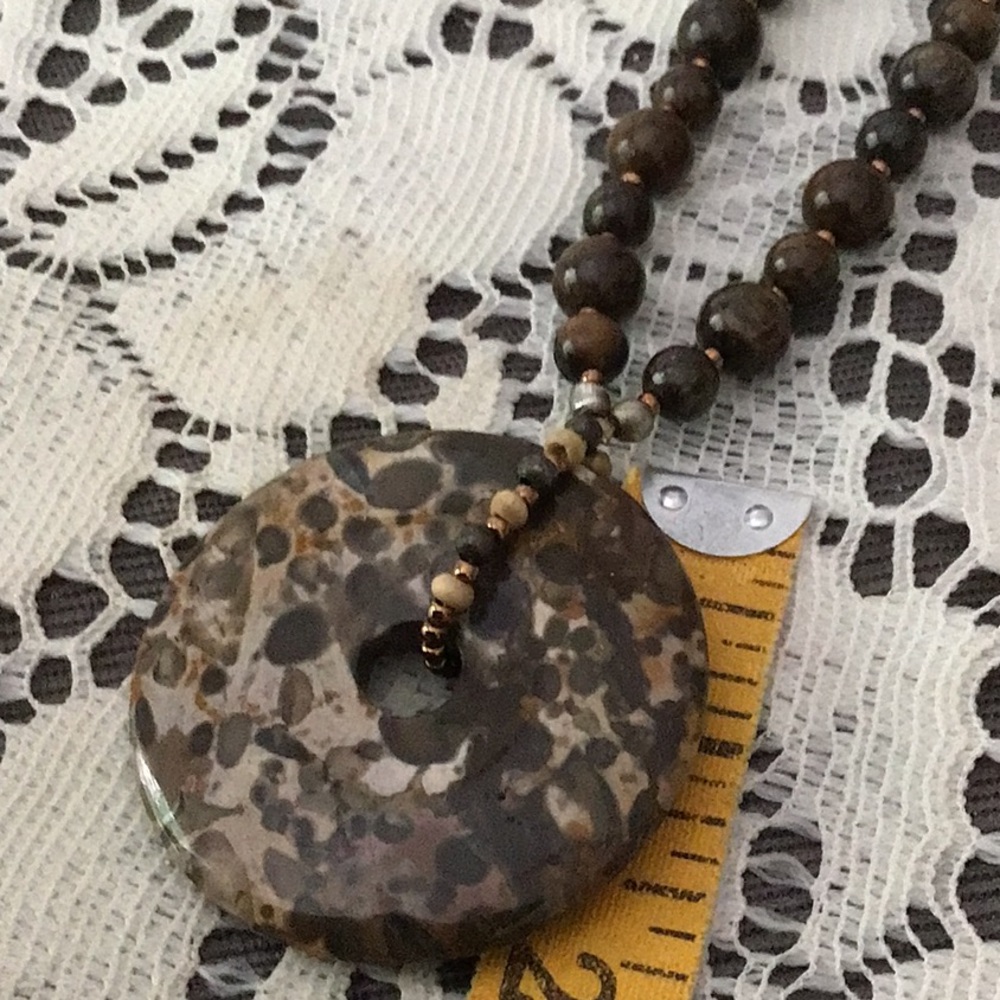 Handmade Natural Turritella/fossil Necklace with Donut Pendant. 18”
2” pendant - Picture 6 of 7